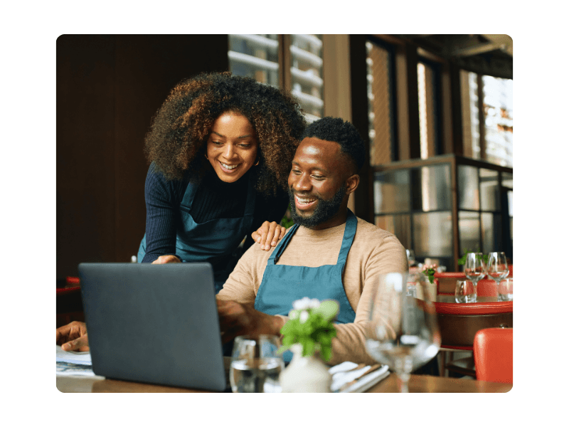Restaurant owners reviewing catering orders together